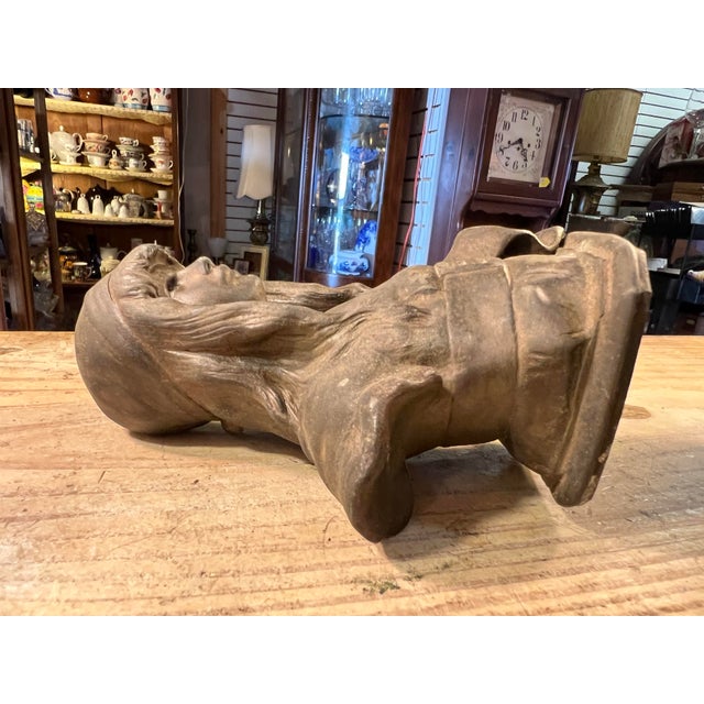 Statue of a young long haired girl. This has a lot of detail with a classic Nouveau style. A very heavy piece I believe it...