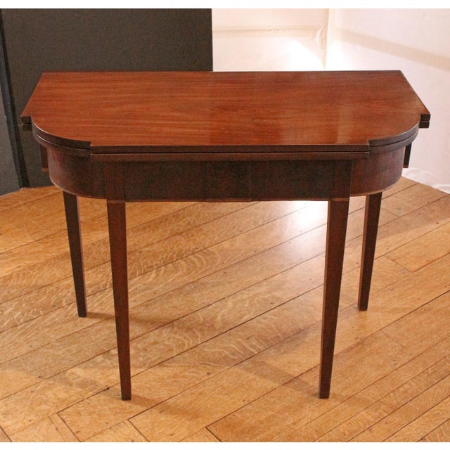 Circa 1780 George III period tea table, English. Mahogany & flame mahogany veneer. Flip top with swing leg. Deal secondary...