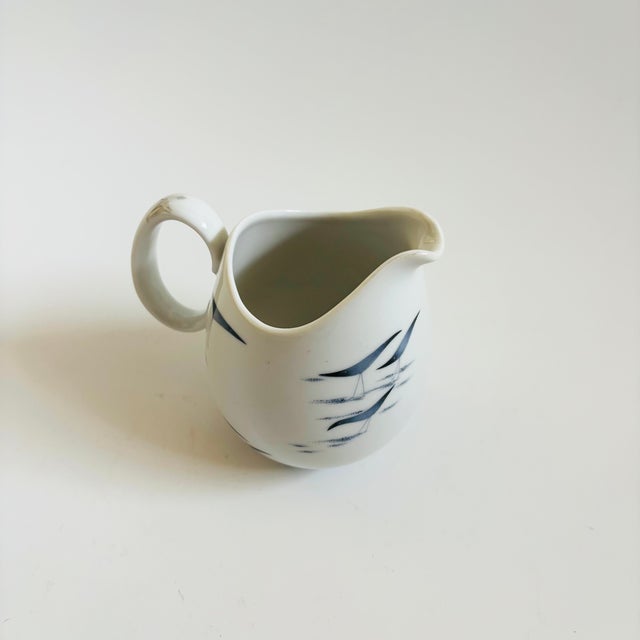 A mid century porcelain creamer pitcehr made in Germany by Rosenthal in the Continental China Conference pattern. Designed...