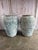 An impressive pair of large vintage like terracotta garden urns featuring a beautifully aged distressed patina in soft...