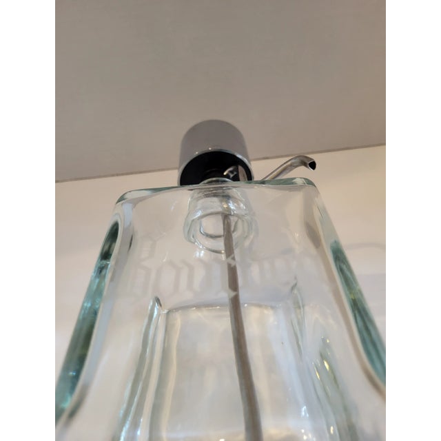 Heavy glass decanter with " bourbon" etched on front. Heavy weight glass with working pump. Chrome top.