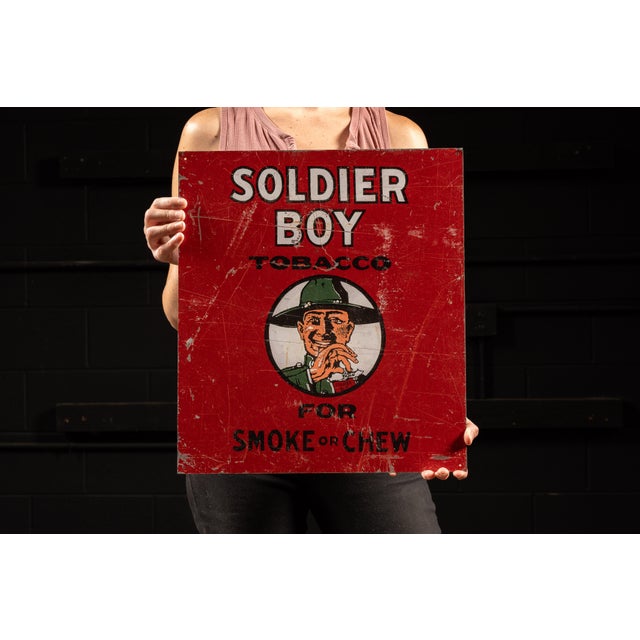Tin lithograph advertising sign for Soldier Boy tobacco. Soldier Boy tobacco was manufactured by The B. Leidersdorf Co. of...