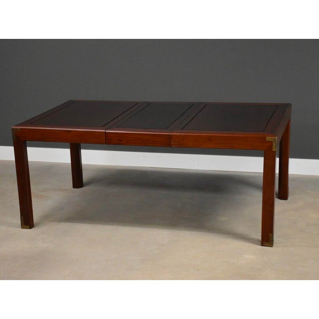 A solid mahogany parson style dining table with two 18” leaves that fully extend the table to 90”. Excellent condition....
