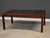 A solid mahogany parson style dining table with two 18” leaves that fully extend the table to 90”. Excellent condition....