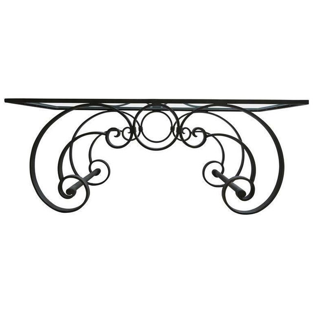 Mars Palm Beach presents: A Mid-Century Modern striking designer classic scrolling wrought iron cocktail table with a...