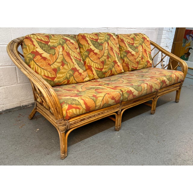 Bring effortless coastal sophistication to your home with this Vintage Palm Beach-Style Reed and Rattan Sofa. Beautifully...