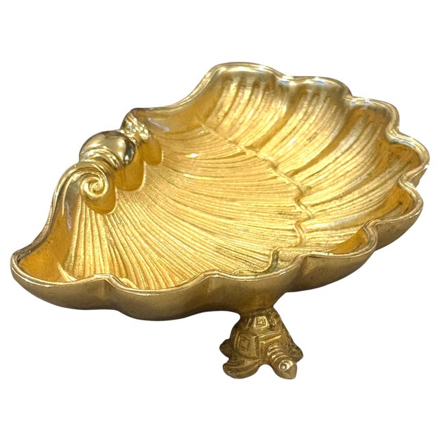 Sherle Wagner soap dish. In the form of a shell balancing on turtle feet. Elegant gold shell-shaped dish with intricate...