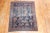 An early 20th Century Scatter square size tribal Persian Tafshar with an all-over design on a navy field. Professionally...