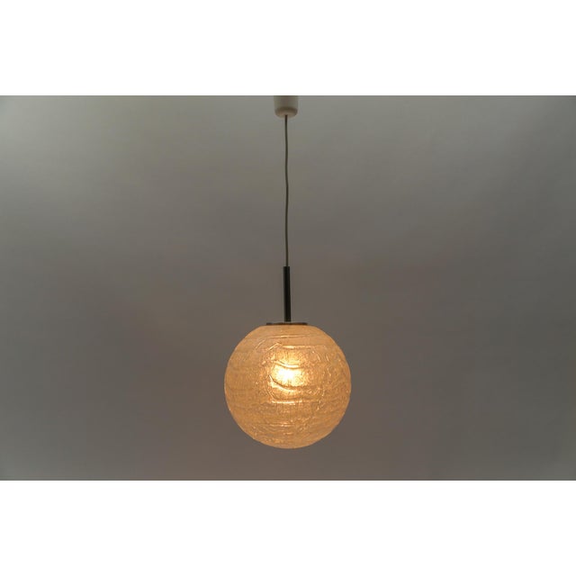Large massive ice glass ball pendant lamp by doria, 1960s germany one e27 socket. Works with 220v and 110v. our lamps are...