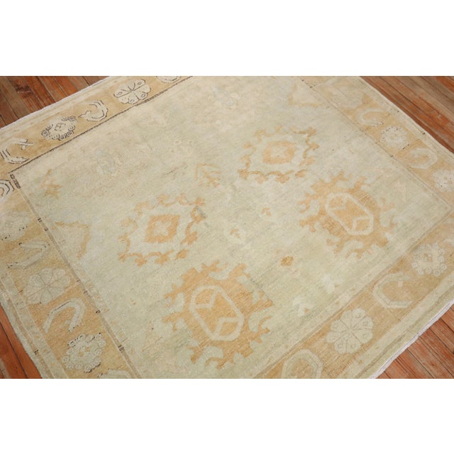 A square-shaped Turkish Oushak rug from the 3rd quarter of the 20th century. Measures: 5'5'' x 5'11".