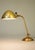 A brilliant and exceptional early Art Deco styled Industrial Machine Age Brass articulating extension table lamp designed...