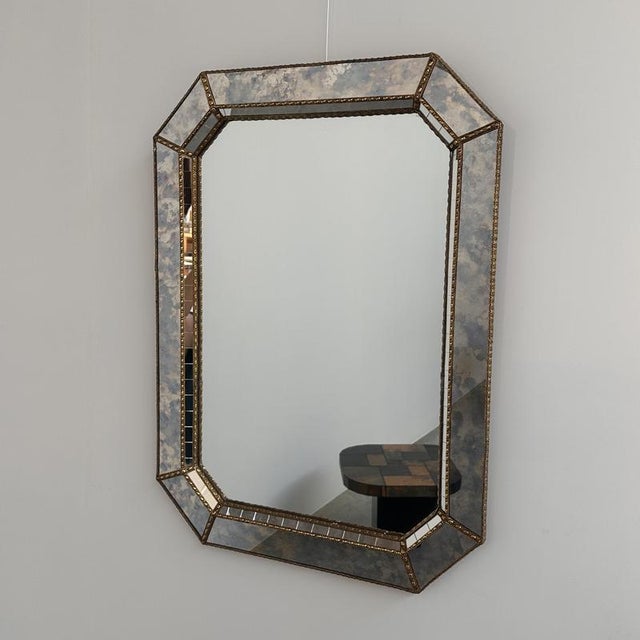 Height: 80 cm (31.5") • Width: 60 cm (23.6") A stunning handcrafted Spanish wall mirror dating from the 1980s,...