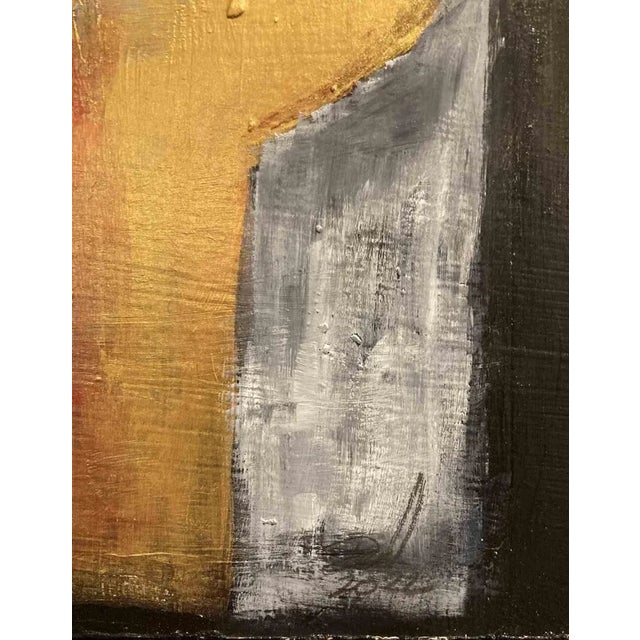 "In this painting there are three heads placed side-by-side in three boxes similar to a triptych. The head in the center...