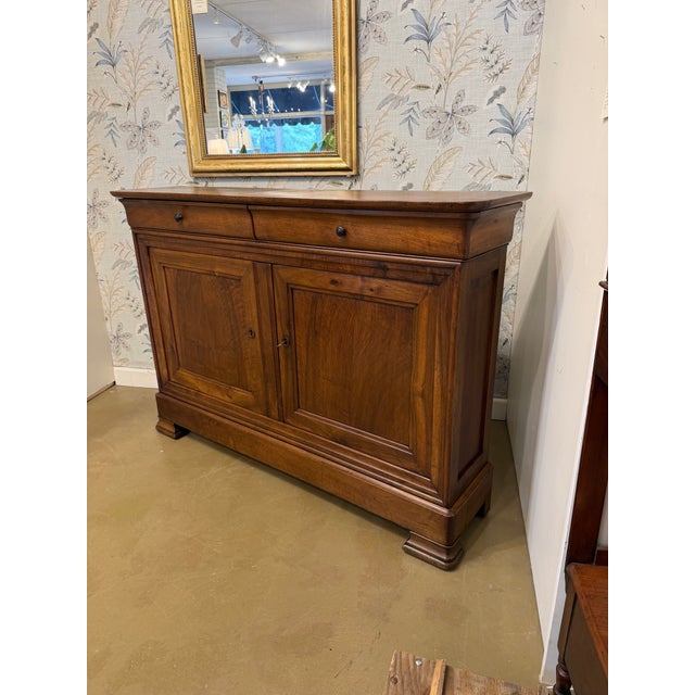 This is such a beautiful and unique French server that dates to the mid 19th century. The wood is walnut which gives off a...