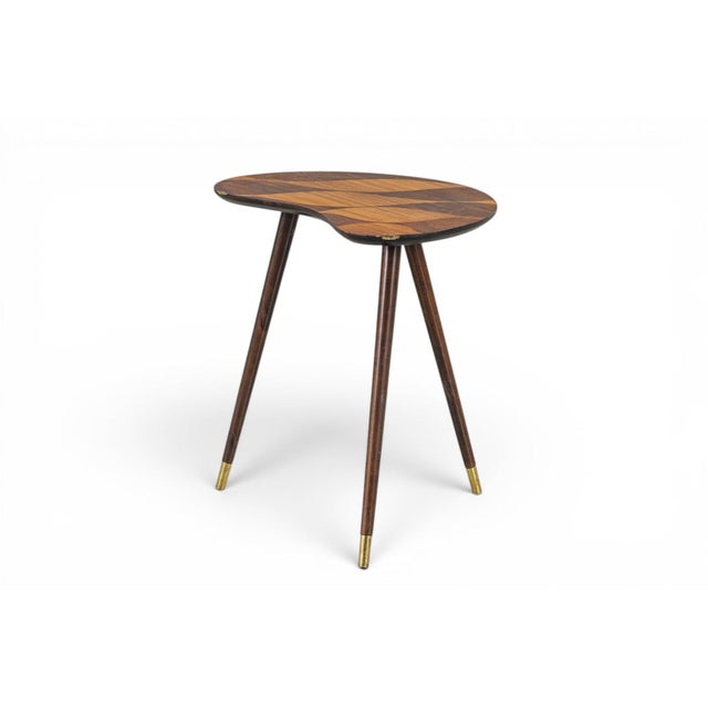 Crafted by Björkås Möbelfabrik, this Model 166 kidney-shaped side table pairs warm beech with a striking rosewood inlay...