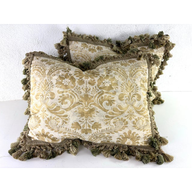 This is a pair of handcrafted Italian Fortuny cotton pillows. These pillows have a cream background with a bronze toned...