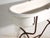 This antique bathtub in enamelled iron rests on a folding stand of bent iron tube. Originates from Central Europe, from...