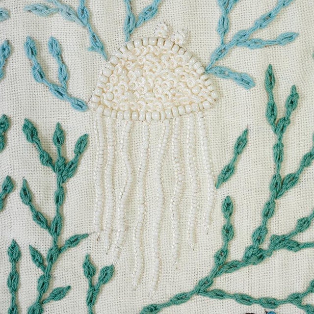 A tour de force of handicraft, this wonderful, whimsical design features exquisitely embroidered sea life made extra...