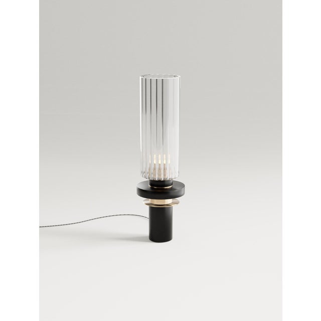 Alexandre table lamp in brass, aluminum, fluted glass by studio marine breynaert. Dimensions: ø 12 × h 41.5 cm. Materials:...