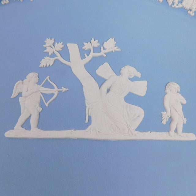 This is a blue oval Jasperware Wedgwood Vanity Tray or Serving platter with a design with cupid on it. The tray is a...