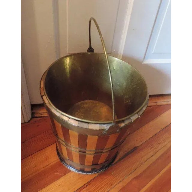 Antique 19th c. Regency Peat Bucket with brass liner and bail handle. Wonderful patina. The wooden staves alternate in...