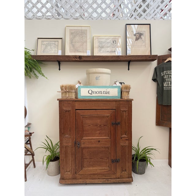 This antique English pine cabinet has that wonderful, understated presence that defines true country furniture. Built from...