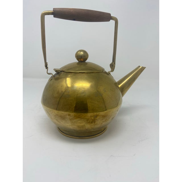 Mod abstract brass kettle/teapot with walnut handle and “ made in Mexico” markings .