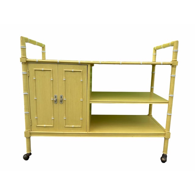 Rare vintage faux bamboo bar cart by Thomasville Furniture Co. This stunning piece was manufactured by Thomasville in the...