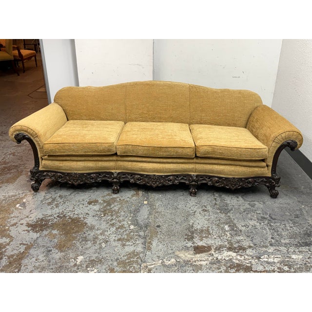 Design Plus Gallery presents a Victorian Sofa from the 1920s. The sofa is defined by its ornate, hand-carved solid wood...
