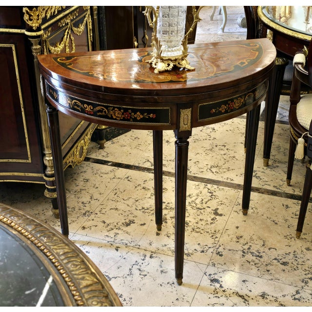 Bring refined European elegance to your interior with this beautiful demi-lune console table, crafted with a rich dark...