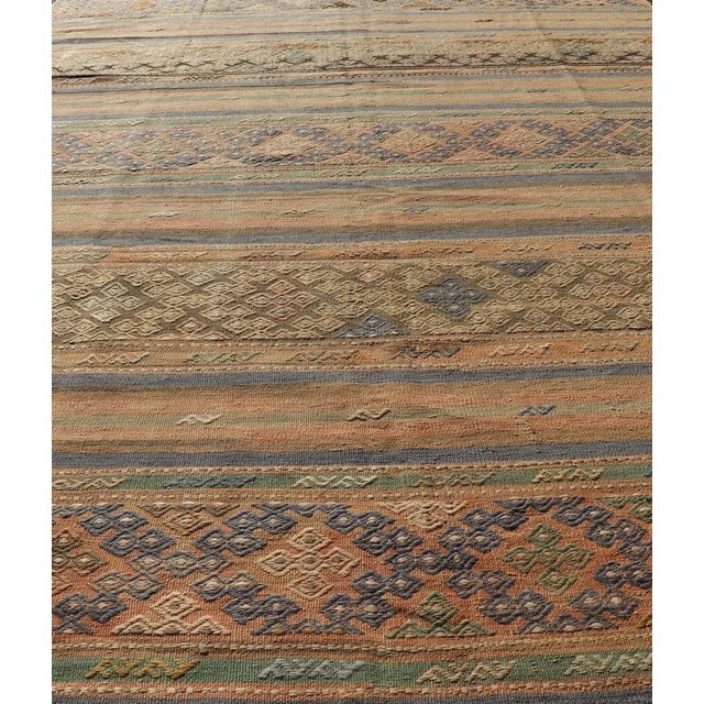 Traditional Mid 20th Century Mid 20th Century Vintage Striped Turkish Kilim Rug With Geometric Shapes and Soft Muted Colors For Sale - Image 3 of 12