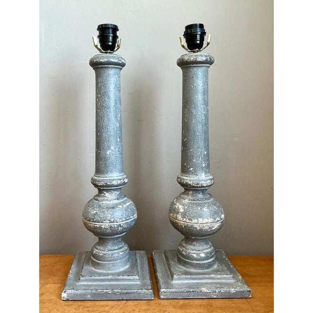 Crafted from solid turned wood, this vintage pair of table lamps draws design inspiration from classic architectural...