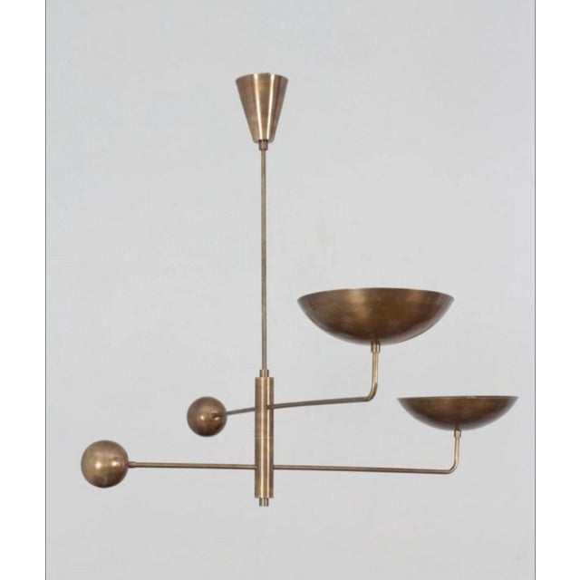 Elegant vintage brass chandelier with a geometric and minimalist design, perfect for modern, industrial, or mid-century...