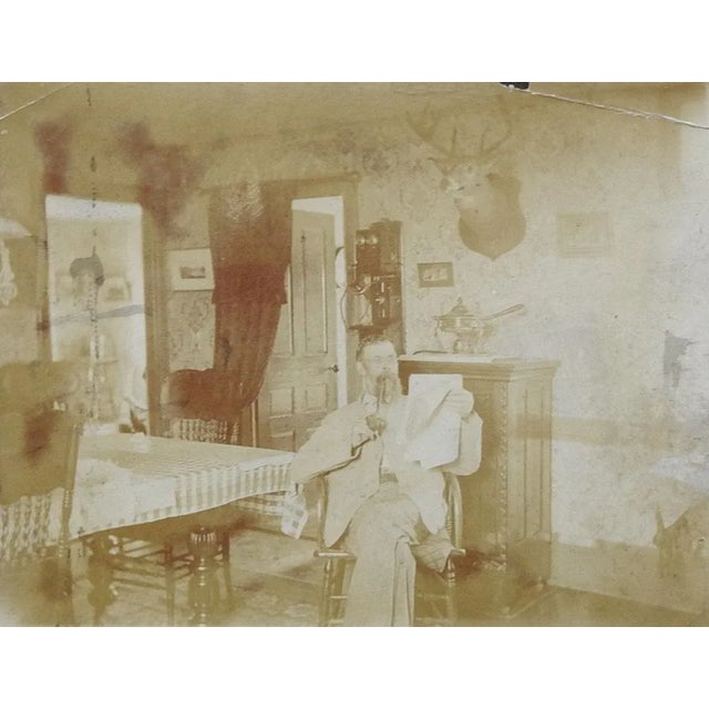 Antique Photograph Interior, Telephone, Deer Mount & Pipe Smoking Man For Sale - Image 4 of 4