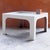 Elegant square coffee table with rounded corners, made of polyester-reinforced fiberglass, lacquered white. France, 1960s...