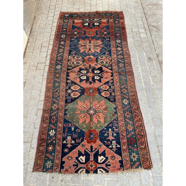 Very beautiful late 19th century tribal rug with a geometrical design and beautiful natural colors with orange, red, blue,...