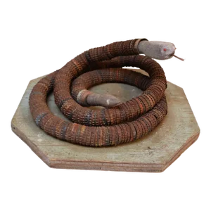 Vintage Folk Art Hand-Carved Wood and Bottlecap Snake on Octagonal Base