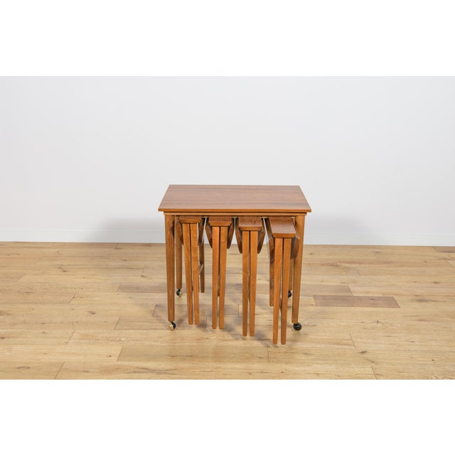 This set of five teak nesting tables was designed by Poul Hundevad in the 1960s for Novy domov in former Czechoslovakia....