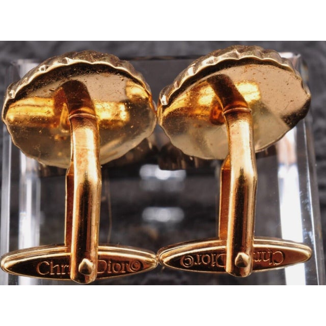 Vintage Christian Dior Gold Plate & Onyx Cufflinks Circa 1990 In Bochic Case Featuring a front Dior logo, a textured...