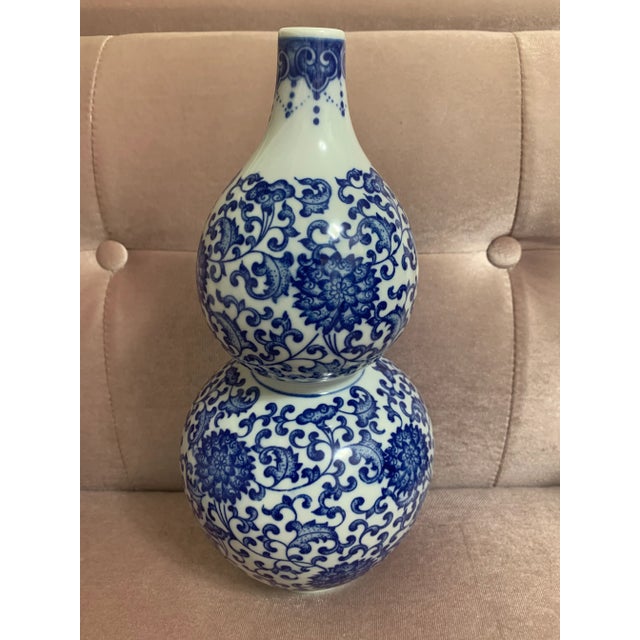 Gorgeous mid 20th century chinese porcelain blue and white double gourd vase decorated with cobalt blue foliate detail on...