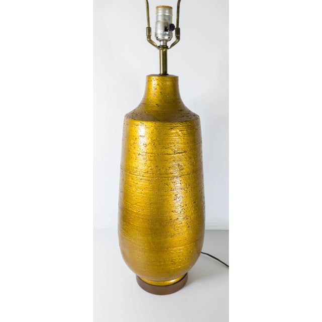 We are selling this attractive Mid-century style lamp. This lamp has great simple form with textured ceramic surface which...