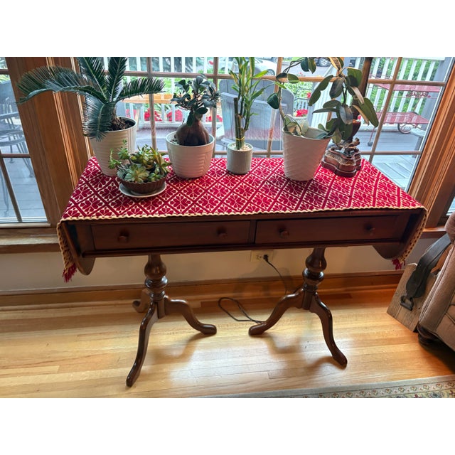 Lovely maple make-up table and bench. Bench has caning. Table has pop-up leaves on each end. Two little drawers provide...