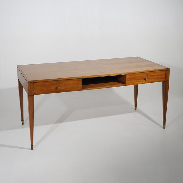 An Italian desk from the 1950s characterised by generous proportions and an essential design, where the clean geometry of...