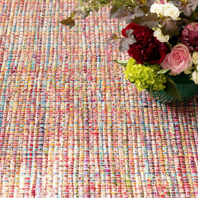 A kaleidoscope of repurposed cotton fabrics, stripped and woven with a white weft brings happy home with this everyday,...