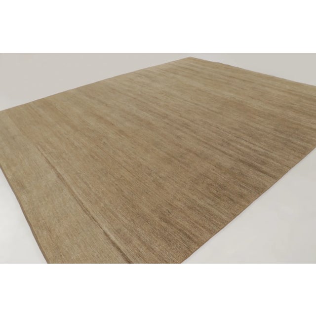 Hand-knotted in luxurious sari silk, this oversized 12x14 contemporary rug joins Rug & Kilim’s Textural collection. The...