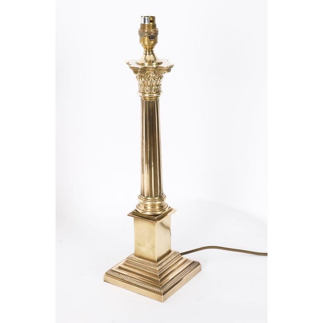 This is an impressive antique pair of bronze Corinthian column table lamps, mid 20th century in date. Each lamp features a...