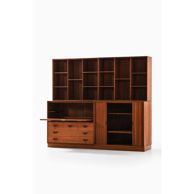 This very rare storage system with integrated bar and writing desk, designed by peter hvidt and orla mølgaard-nielsen and...