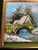 An original small oil on canvas board: a humped stone bridge over a partly frozen stream, a cottage or mill beyond, a bare...