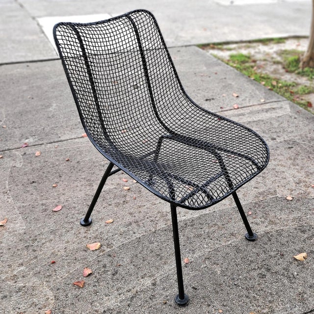 A set of low 'Sculptura' side chairs designed in 1956 by Russell Woodard and produced by the Woodard Furniture Company of...