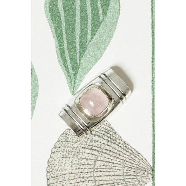 Lovely silver brooch by Elis Kauppi, in a rectangular form with a large rose quartz stone in the center. Beautiful, crisp...